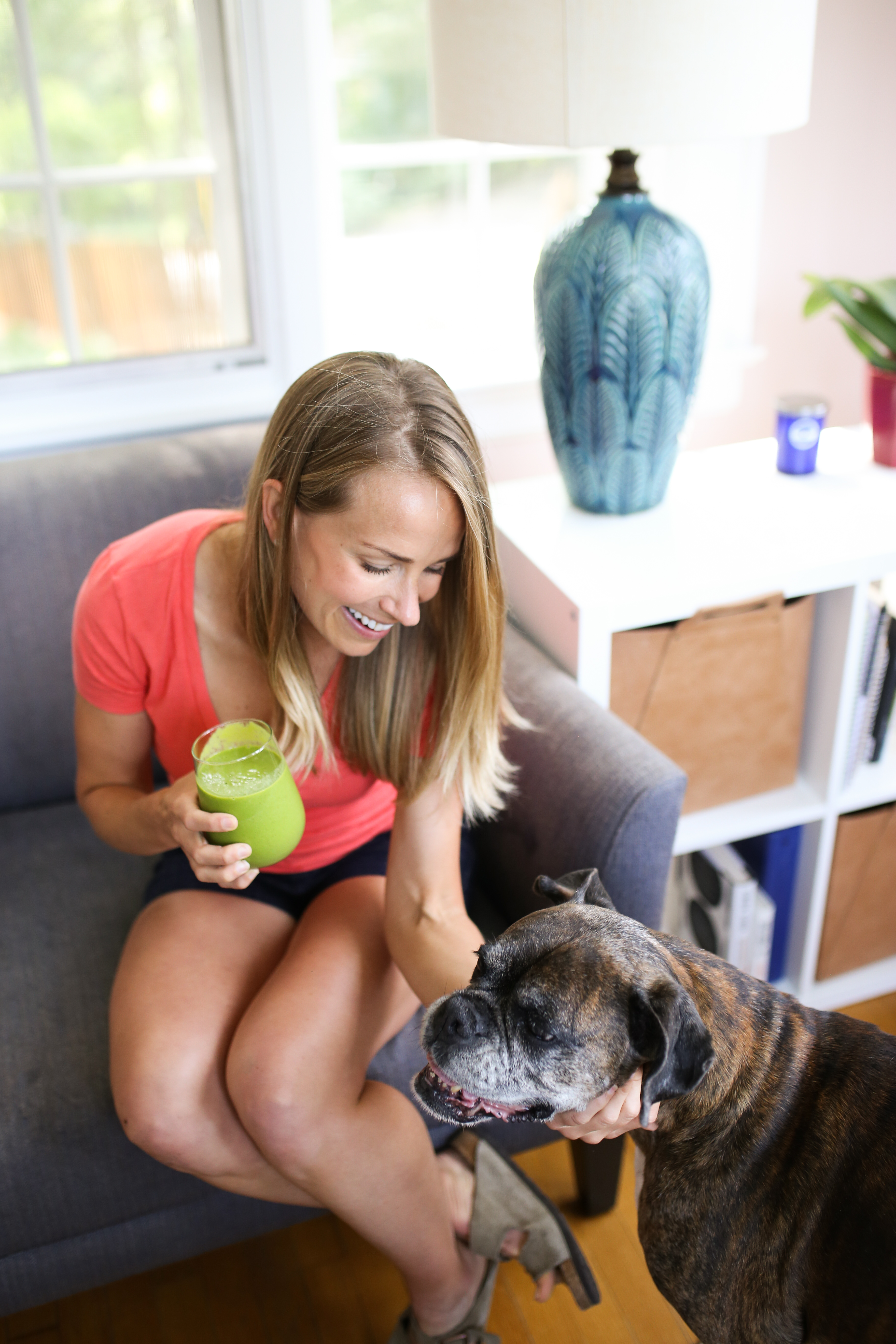 teri and dog, holding green smoothie