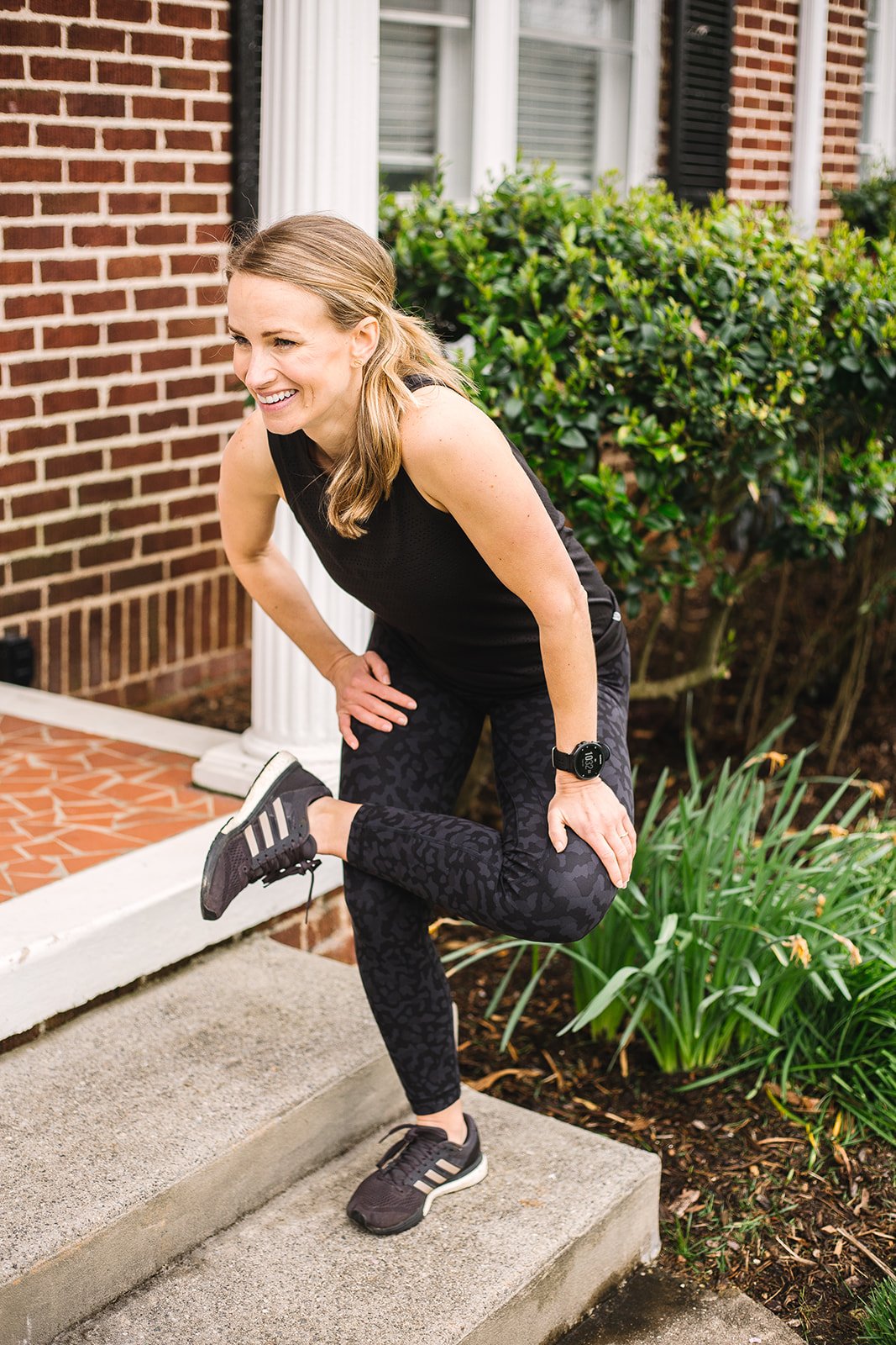 Runner stretching at steps | Dynamic Warm Up Exercises for Running