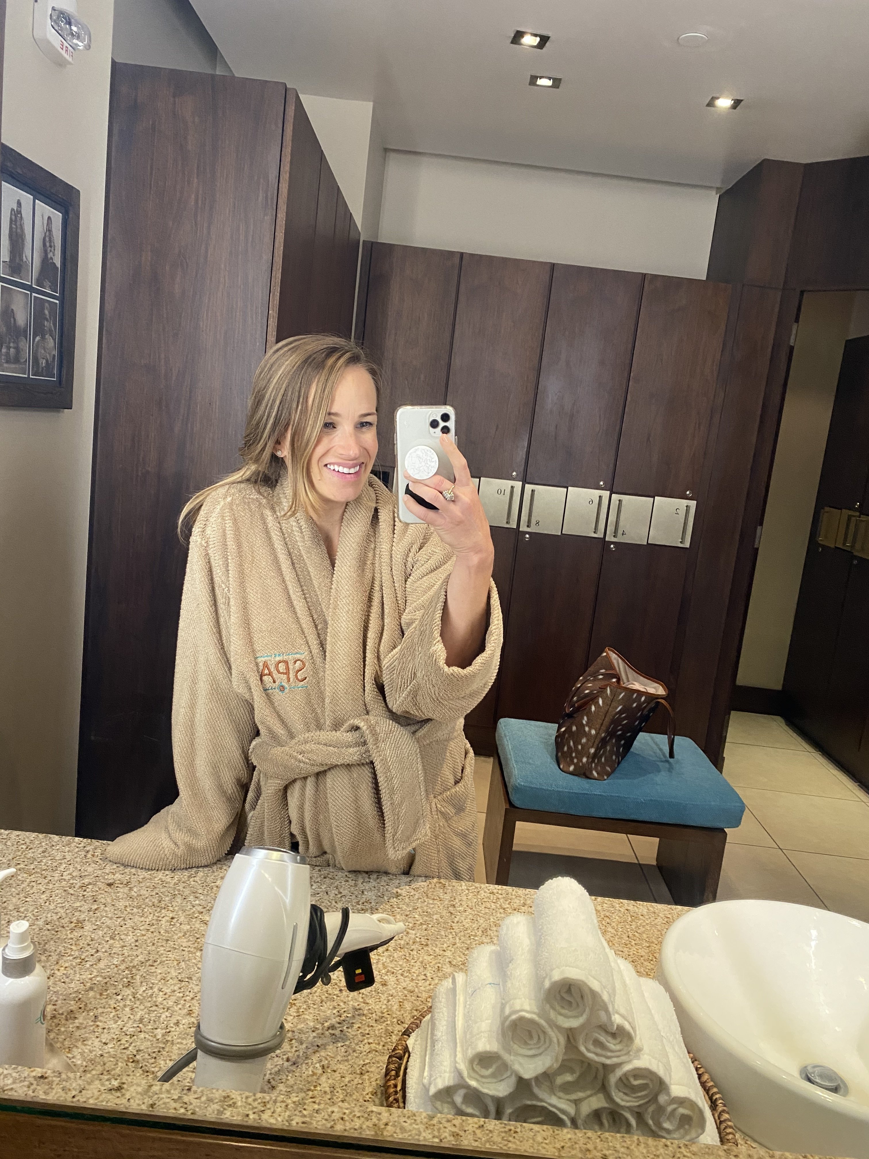 TeriLyn Adams taking a mirror bathrobe selfie