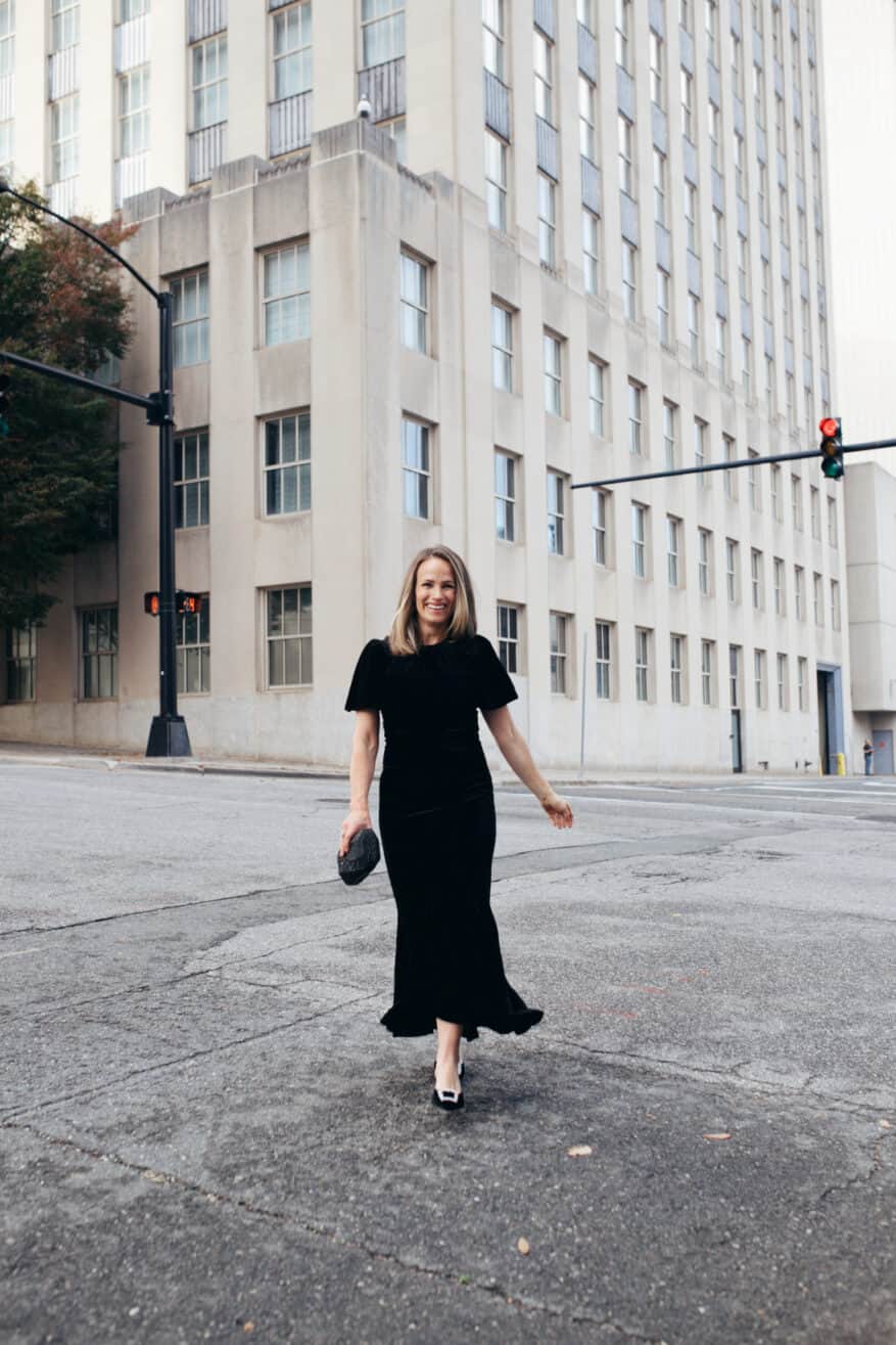Woman wearing velvet Elodie Dress from Tuckernuck