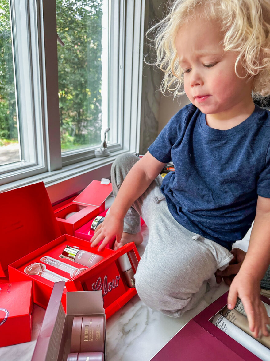 a kid playing with Beautycounter Holiday Sets