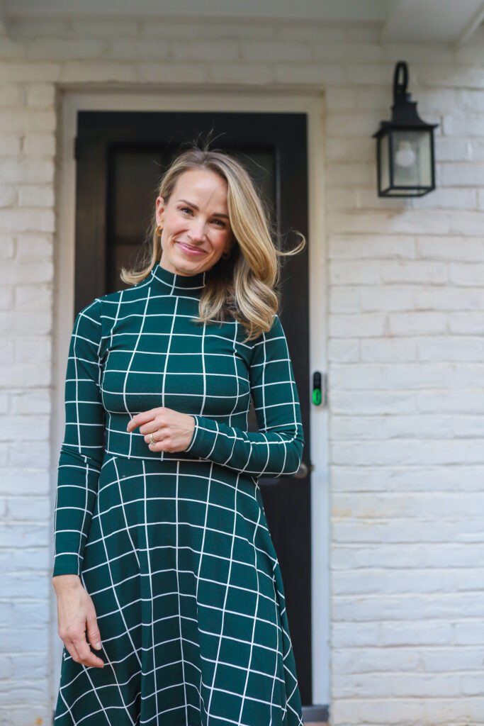 woman wearing one of her Tartan Plaid Dresses in High Neck Plaid Fit and Flare Midi Dress