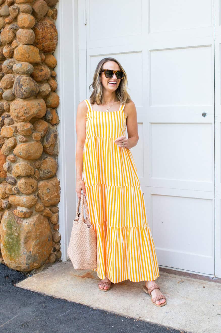 Woman wearing Britt Tiered Maxi Tent Dress in yellow and white stripe