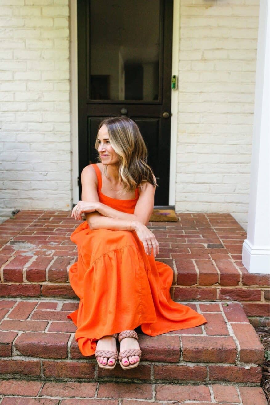 Woman wearing Britt Tiered Maxi Tent Dress in orange