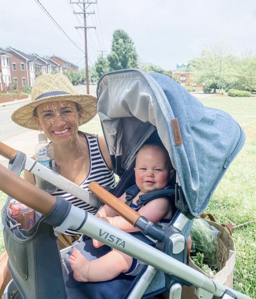 mom using the Uppababy Vista Stroller for her baby
