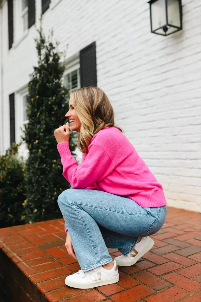 TeriLyn Adams wearing pink sweater and Vejas sneakers - one of the Shoes to Wear with Mom Jeans