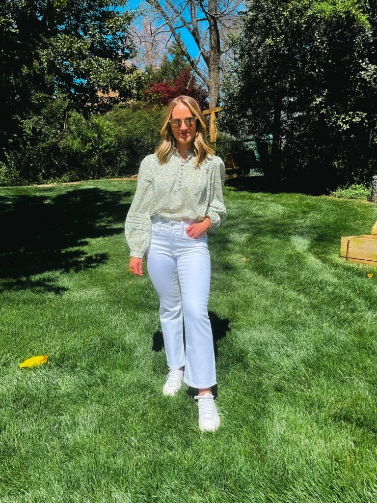 TeriLyn Adams wearing white jeans and a blouse and sharing What to Wear to the Masters Golf Tournament