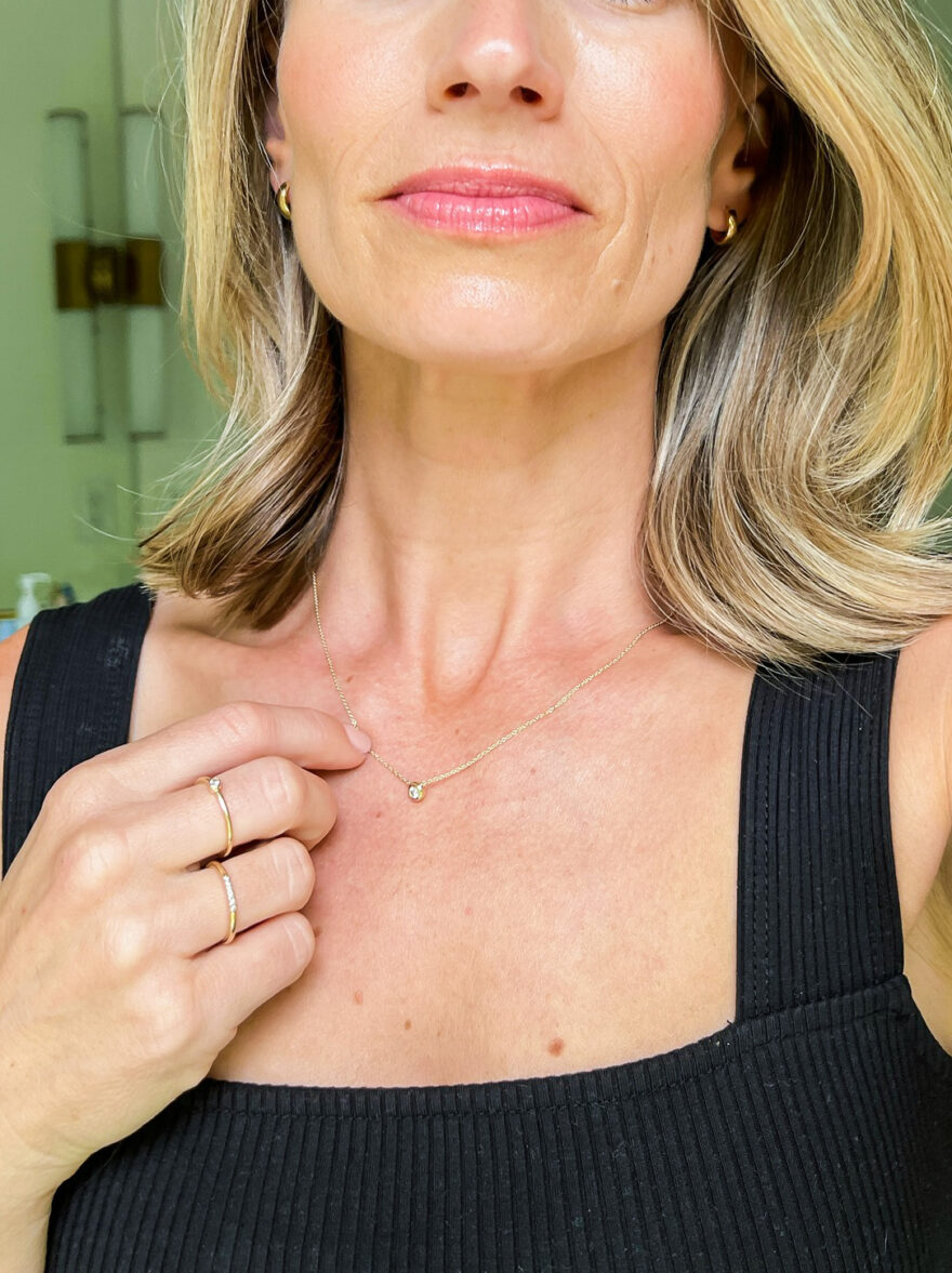 TeriLyn Adams on black top and wearing the Mejuri Diamond Necklace
