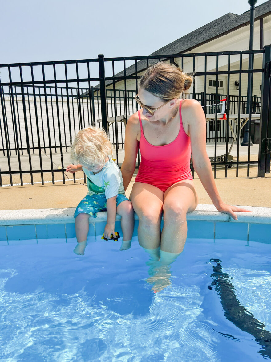 woman with her kid at the poolside
