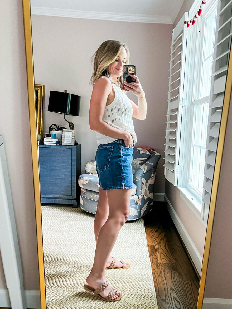 woman showing the side and back details of her Madewell Relaxed Denim Shorts 
