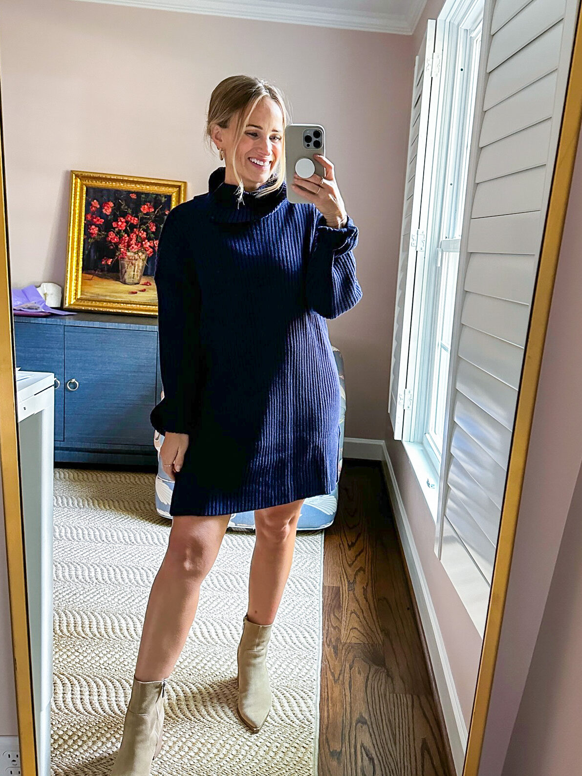 woman taking selfie wearing oversized sleeve sweater dress one of the Affordable Fall Dresses