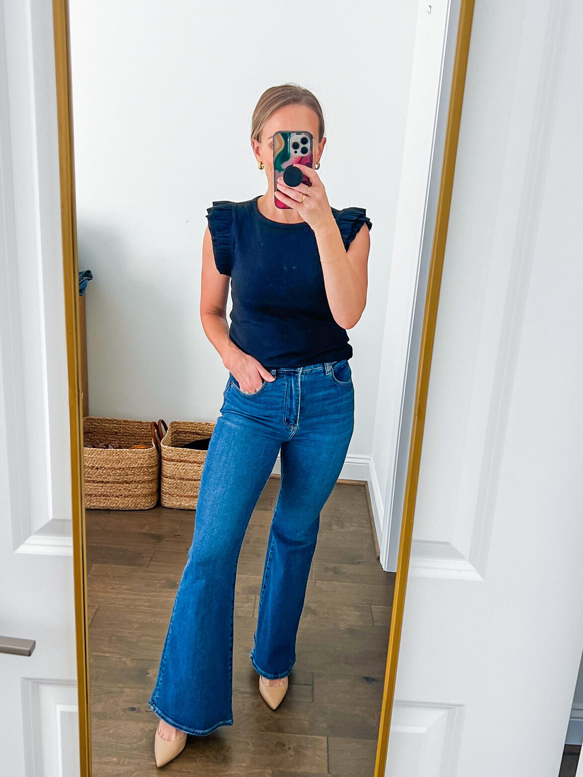 TeriLyn Adams wearing one of the Best Abercrombie Jeans in Ultra High Rise Flare Jean in black and dark blue wash