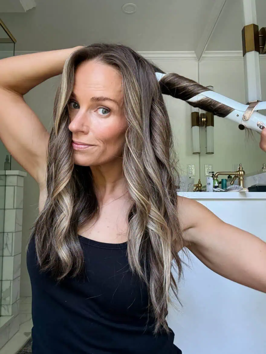 TeriLyn Adams using t3 curling iron to curl her hair