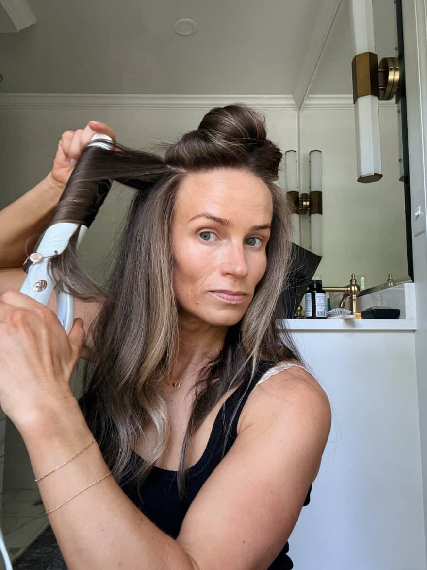 TeriLyn Adams using t3 curling iron to curl her hair