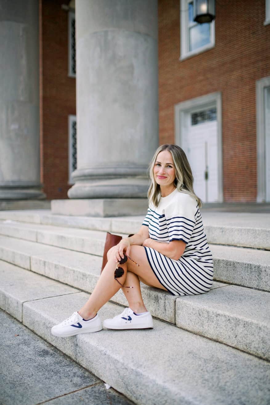 Woman wearing Navy Knit Striped Frenchie Dress by Tuckernuck with sneakers