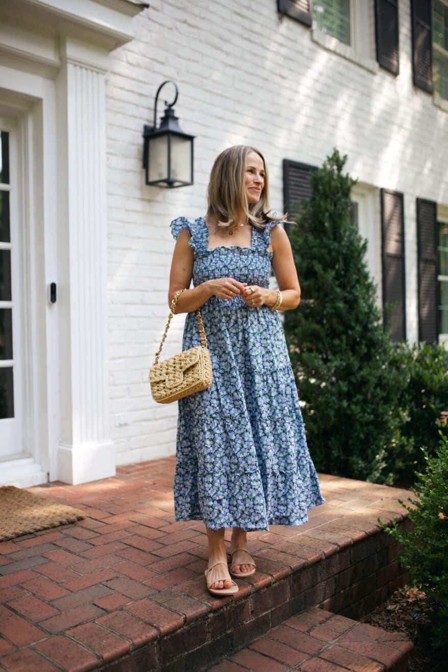 TeriLyn Adams wearing Hill House Ellie Nap dress and a straw bag