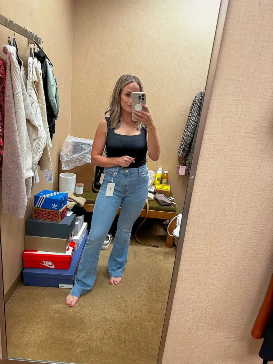 Woman wearing FRAME Le Easy Flare Raw Hem Jeans 