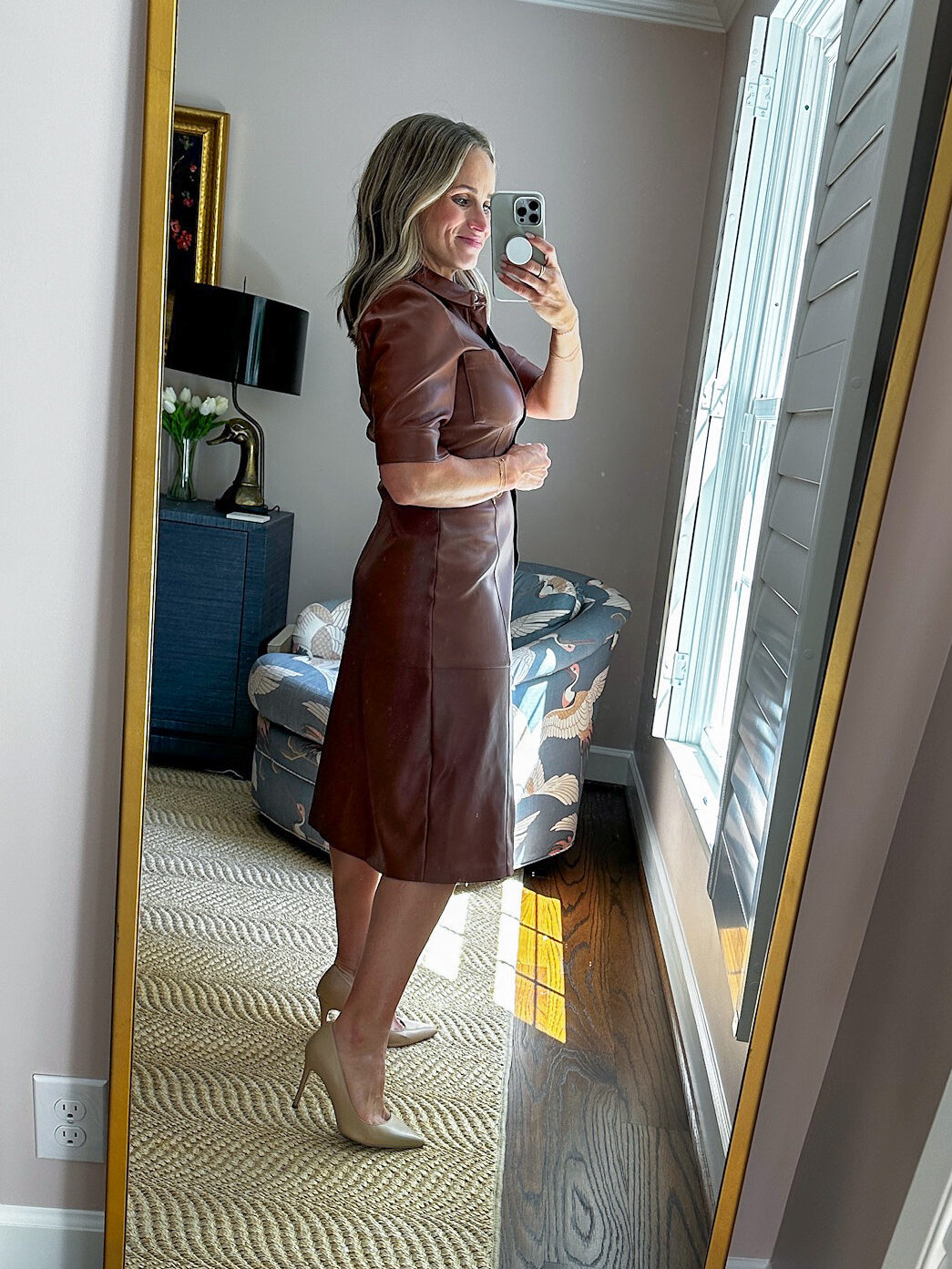Woman showing side view of Steve Madden Laken Faux Leather Shirtdress