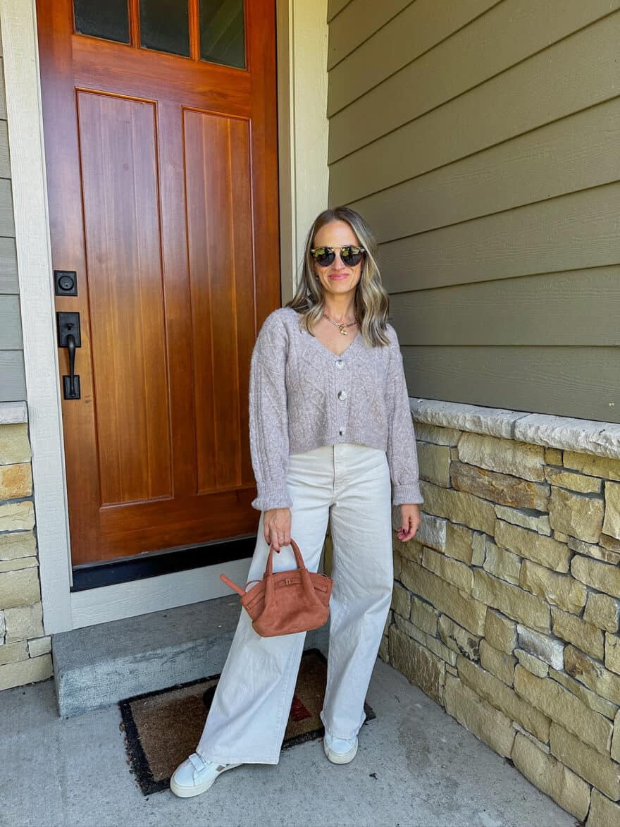 Woman wearing wide-leg jeans with cropped sweater