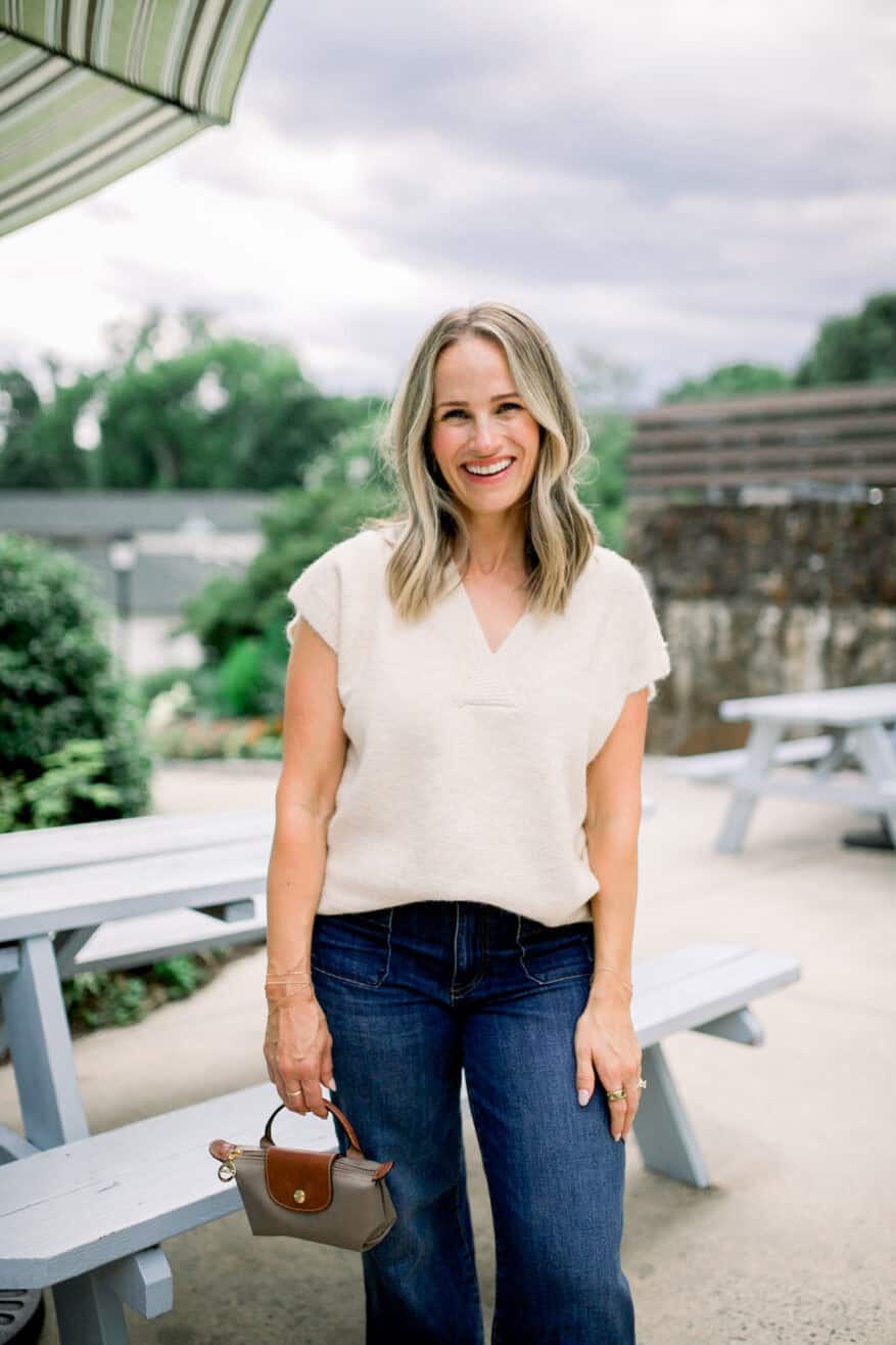 Woman wearing front-tuck with wide-leg jeans