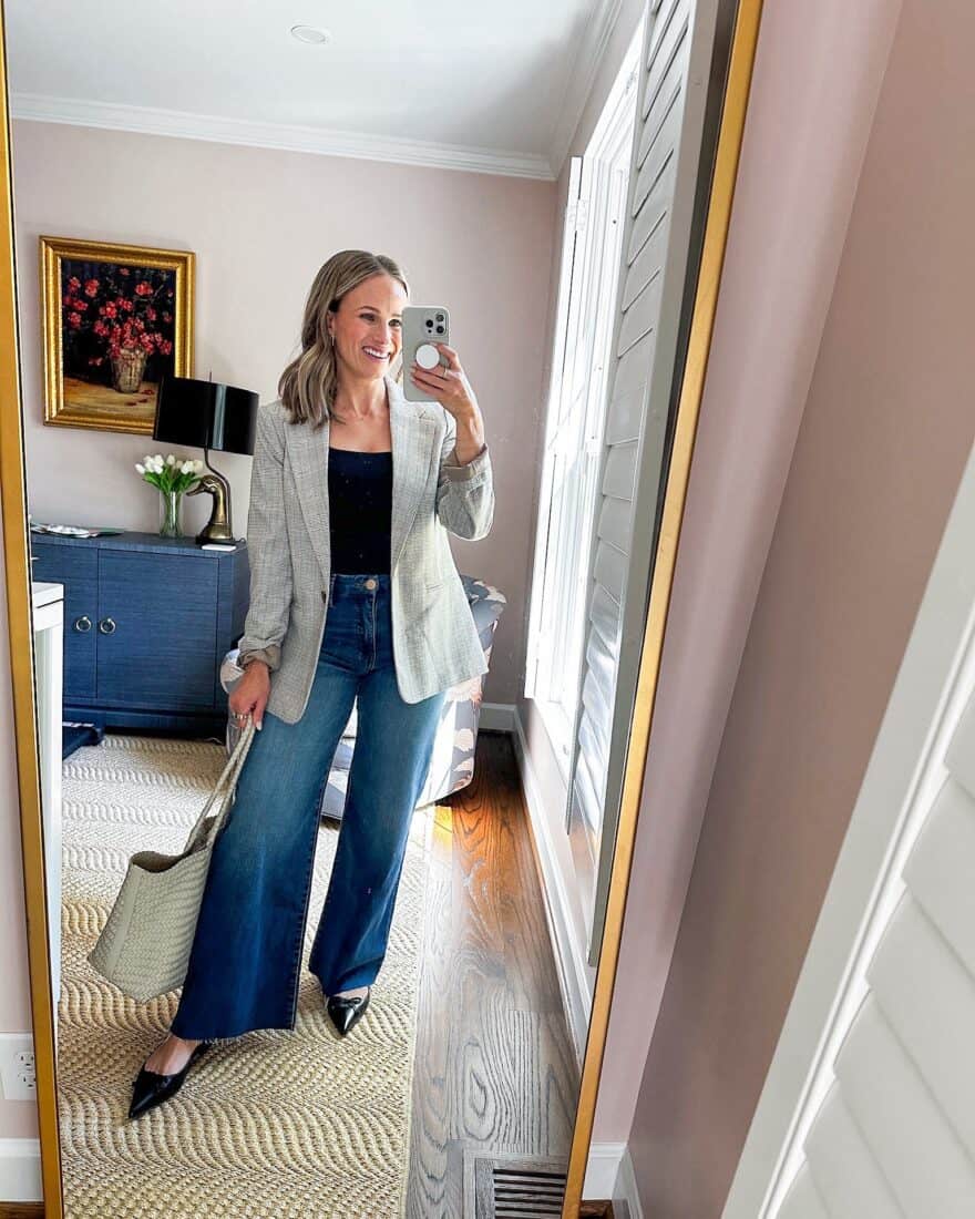 Woman styling wide-leg jeans with heels