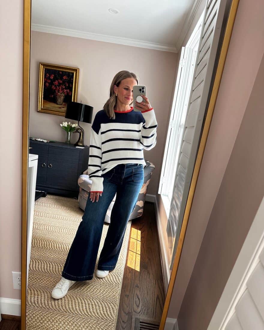 Woman wearing sweater with wide-leg jeans