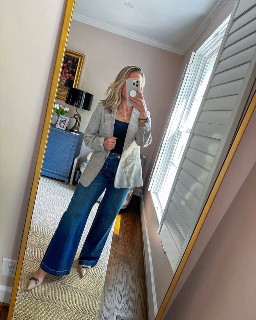 Woman wearing wide-leg jeans with blazer