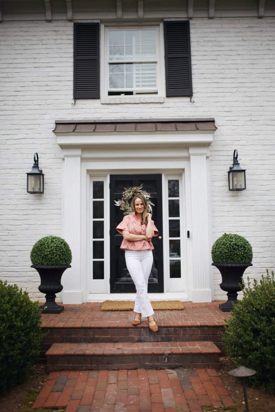 Woman standing on front porch