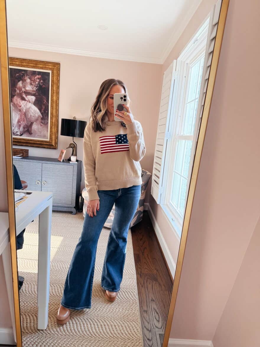 Woman wearing mules and flare jeans