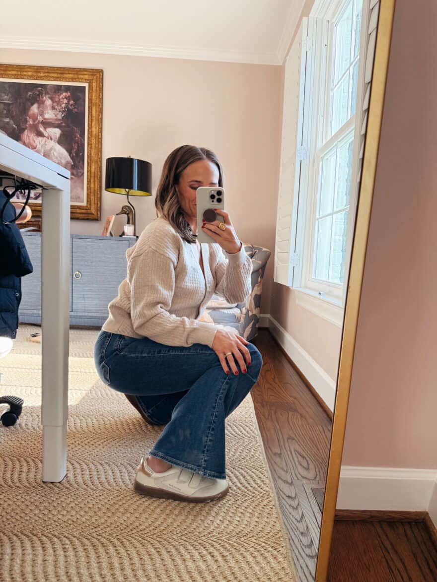 Woman wearing fashion sneakers with flare jeans