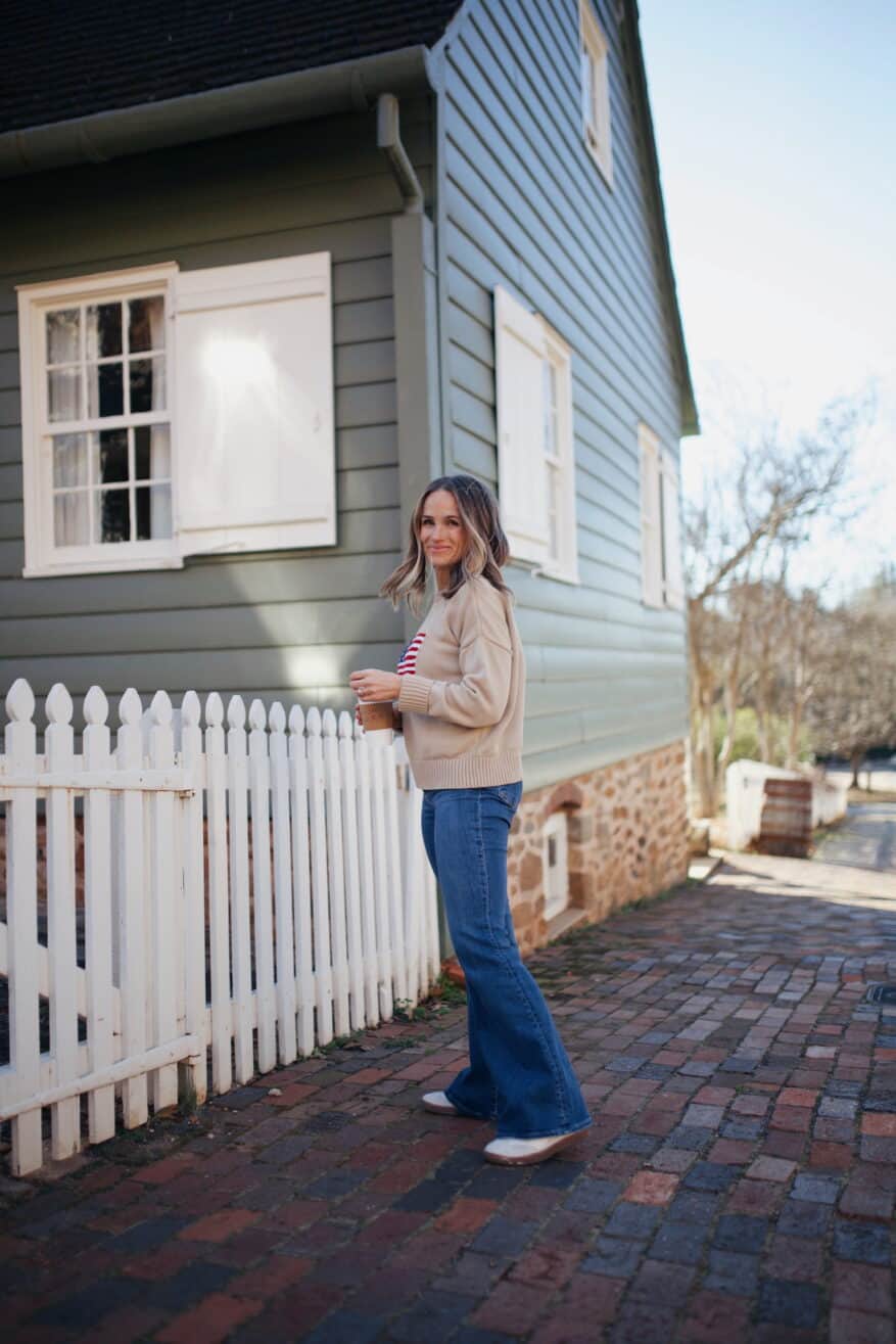 Woman wearing Talia sneakers with flare jeans