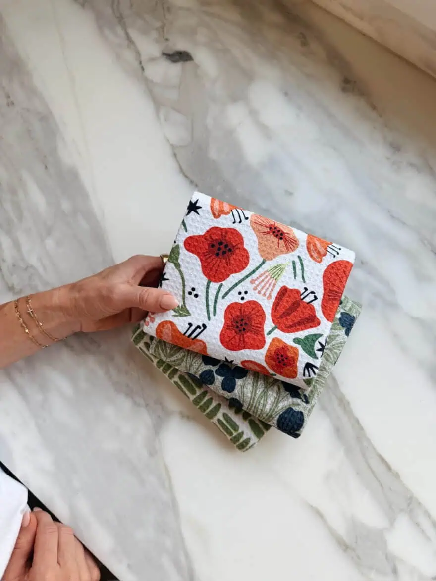 Woman holding Geometry tea towels
