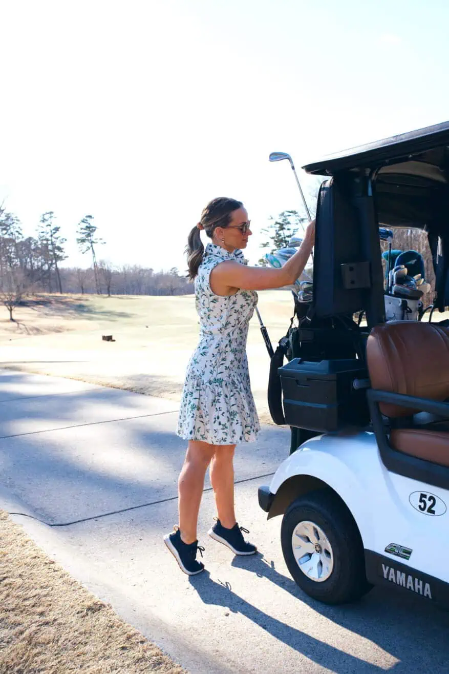 Woman wearing A. Putnam Garden Dress while golfing