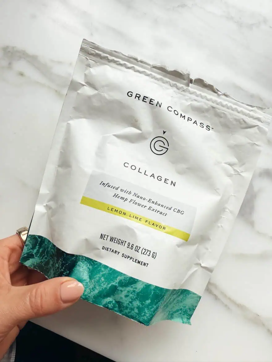 Woman holding Green Compass Collagen
