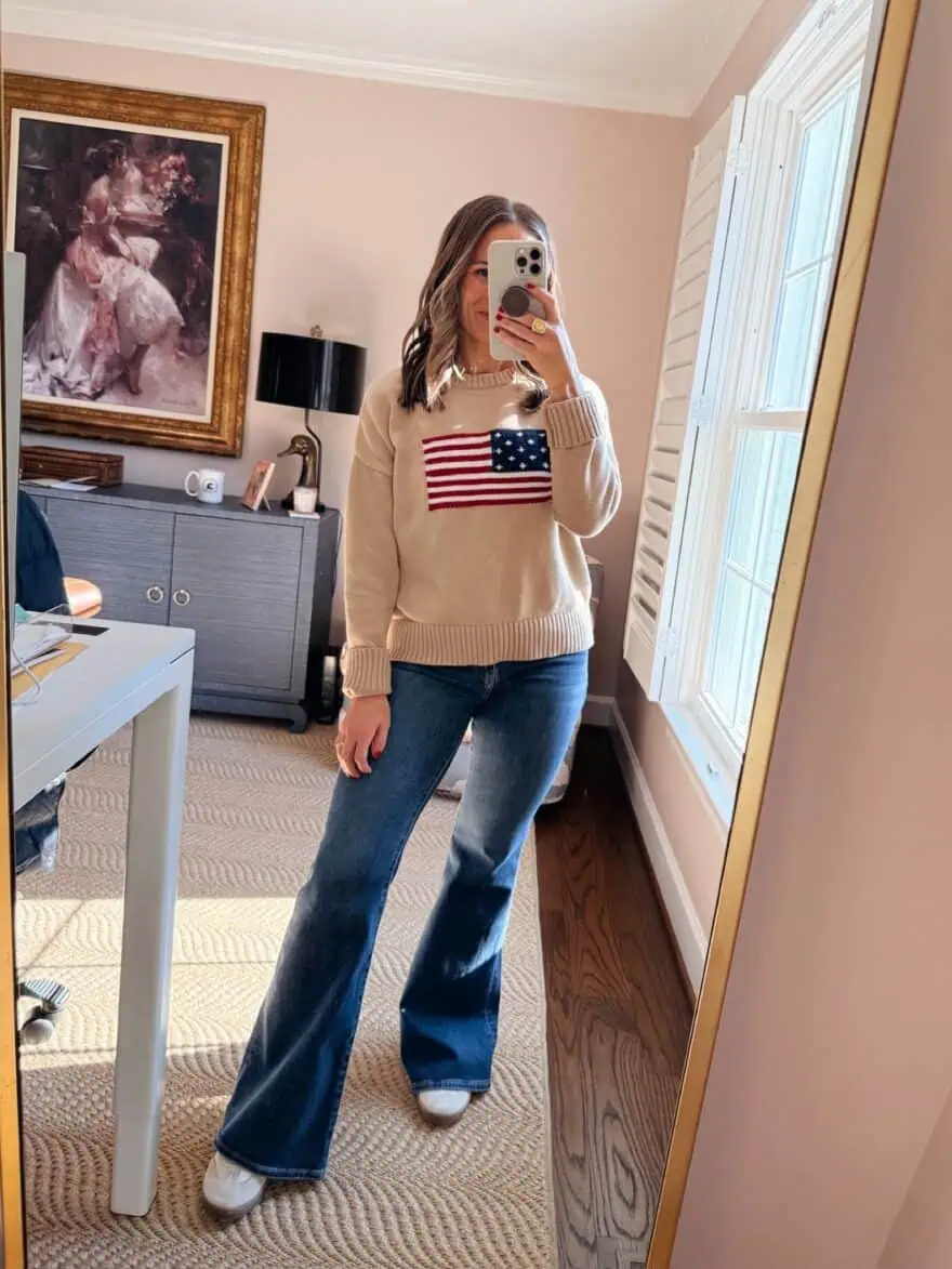 Woman wearing flare jeans with sweater 