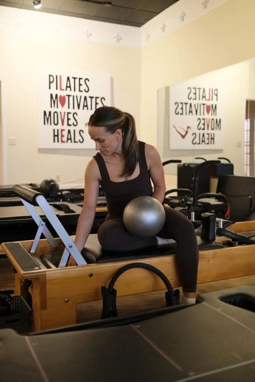 Woman at Pilates wearing leggings and top