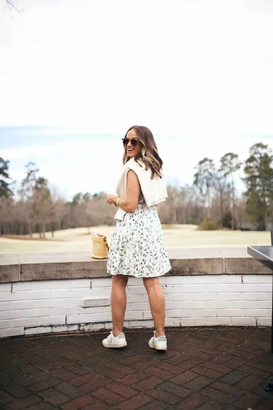 Woman wearing dress at golf tournament