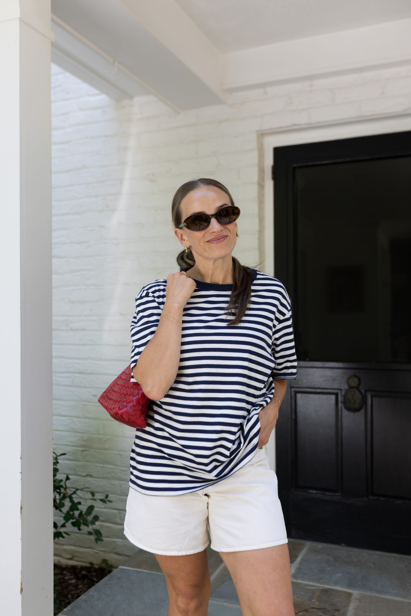 TeriLyn Adams wearing Abercrombie high rise dad shorts in white denim with stripe tee