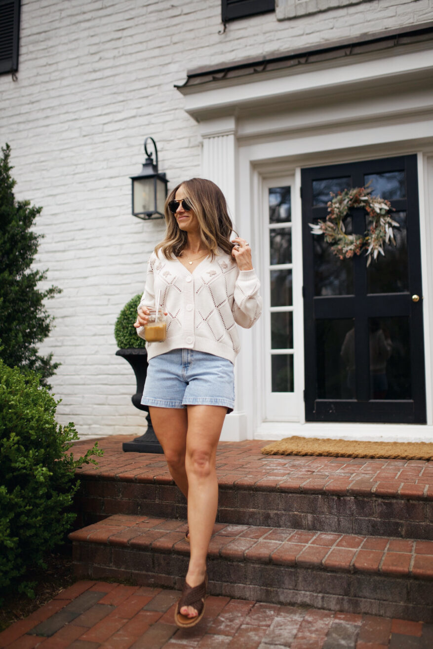 Woman wearing Abercrombie High Rise Dad Shorts with sweater