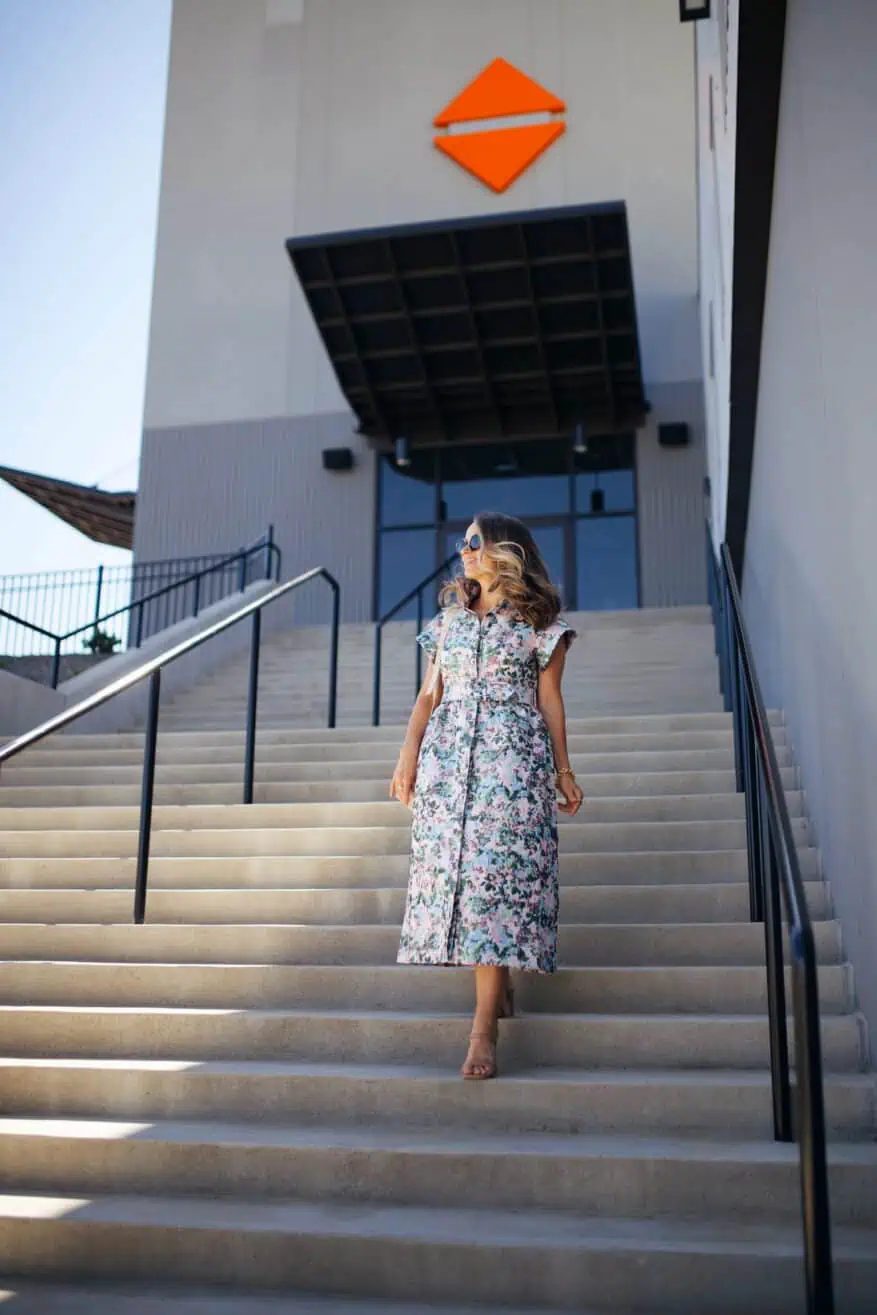 Woman walking down stairs in long dress