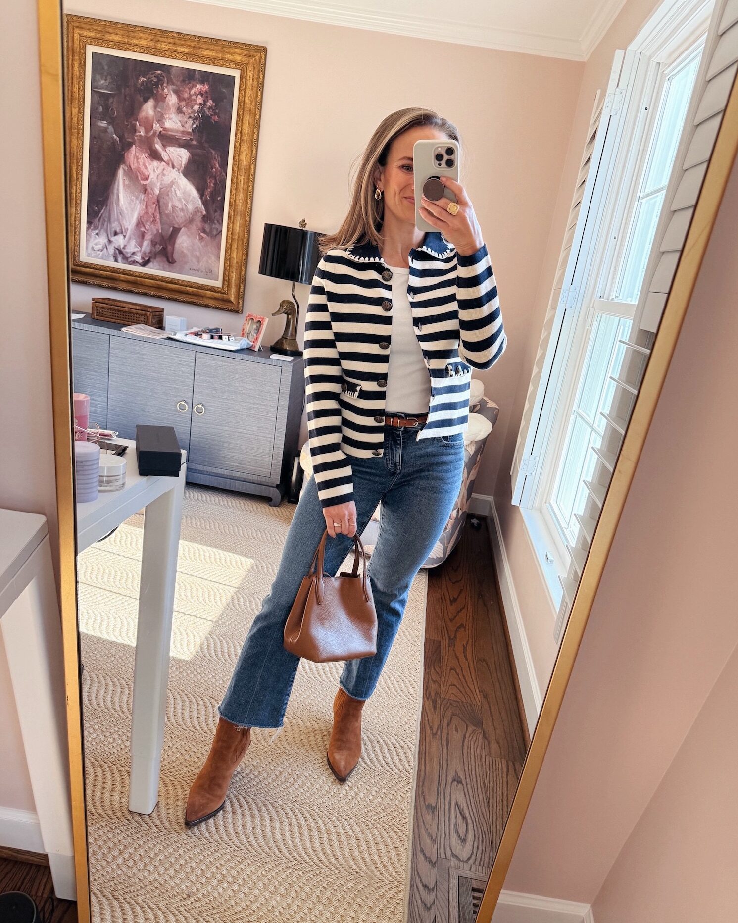 Woman wearing Kick Out Crop Jeans with boots