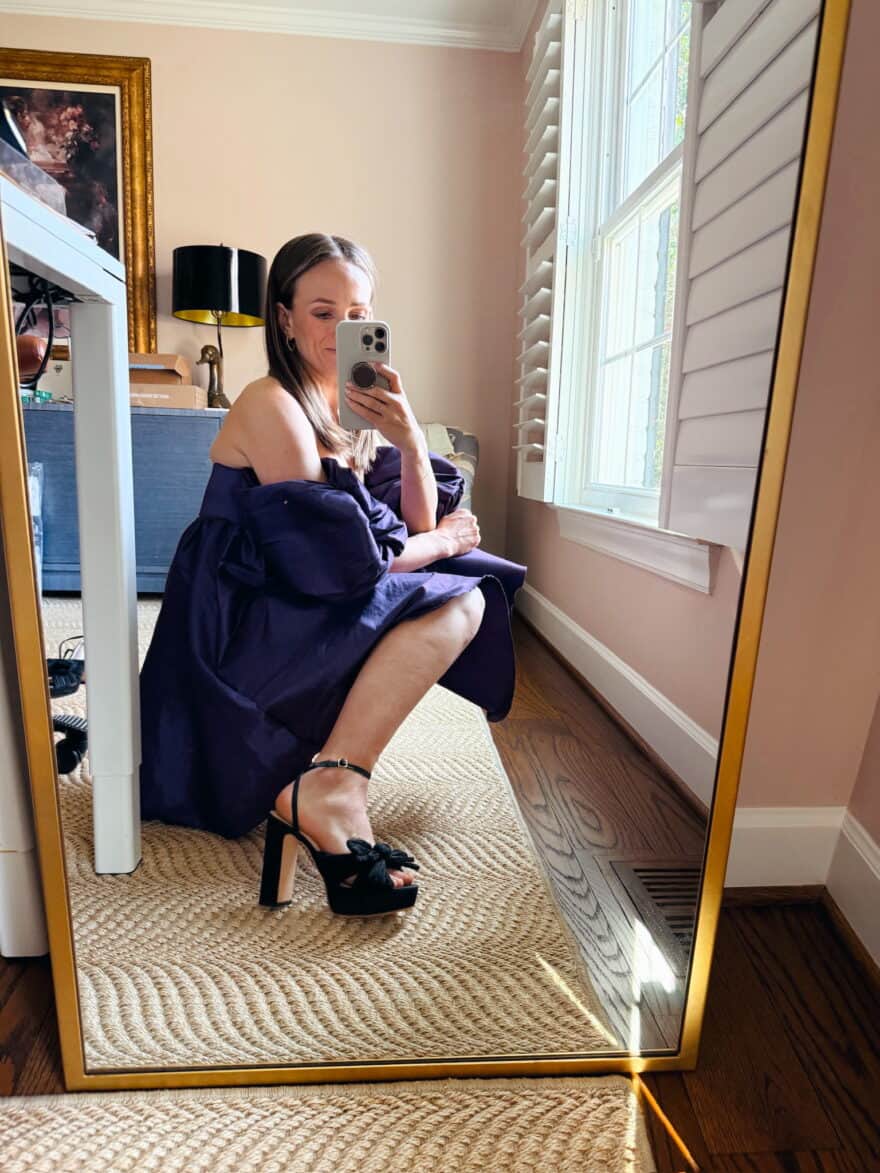 Woman wearing cocktail dress with Natalia Black Platform Bow Heels