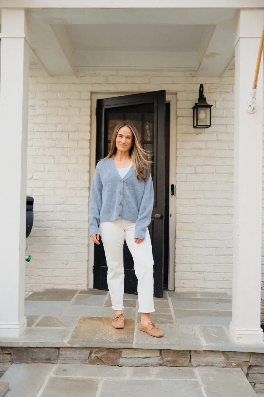 Woman wearing Madewell straight jeans in white