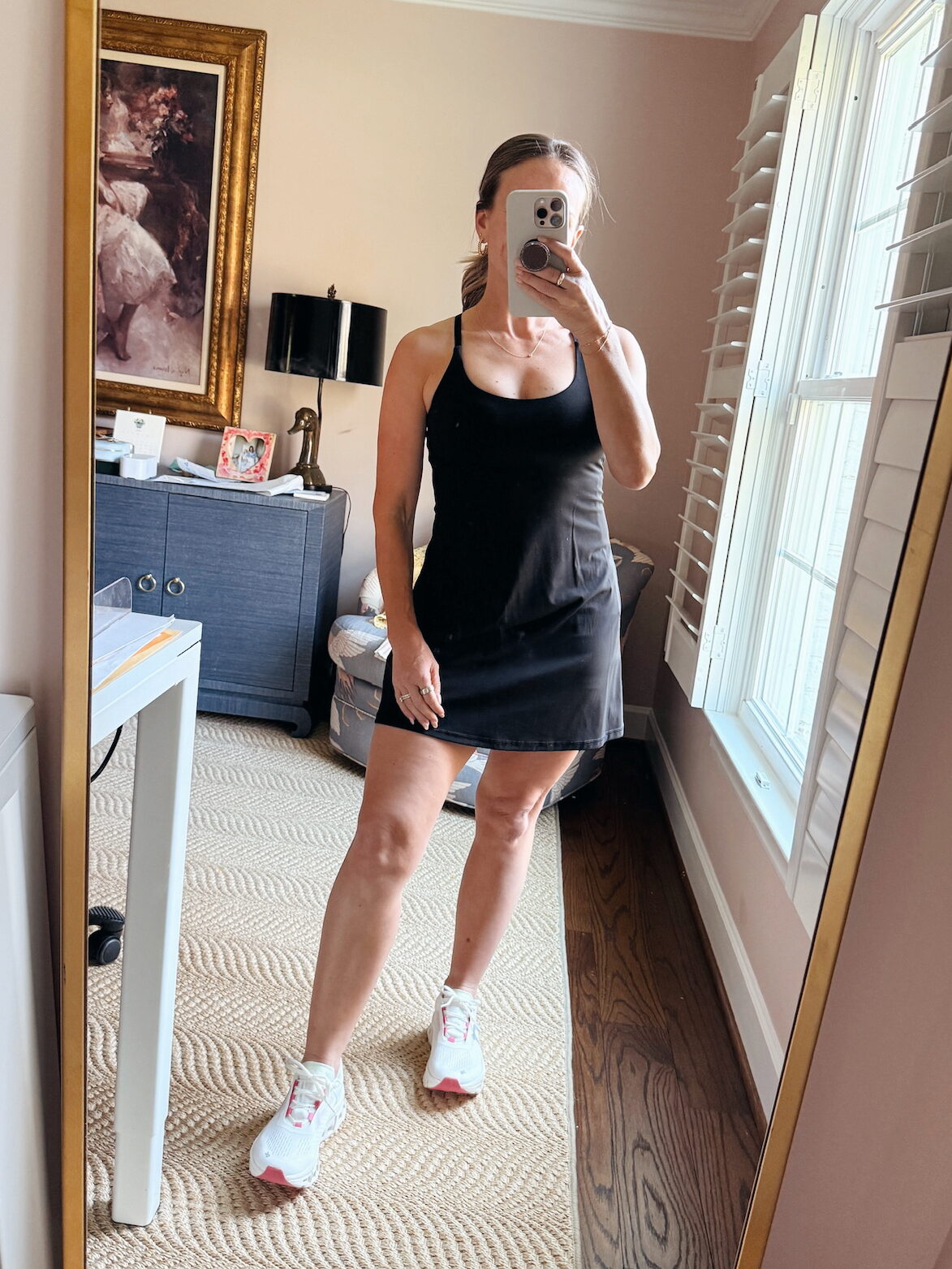 Woman wearing On Cloudmonster with athletic dress