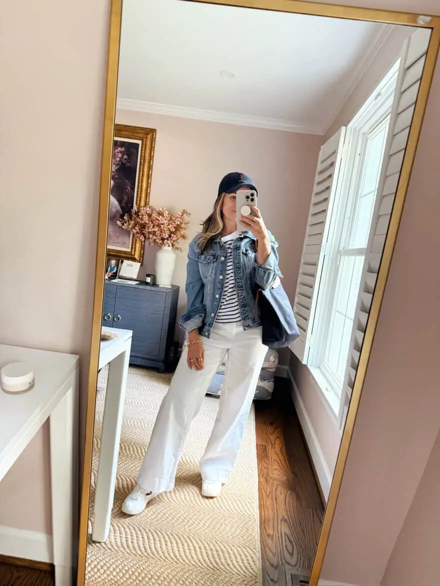 Woman styling white linen pants with striped shirt and jean jacket