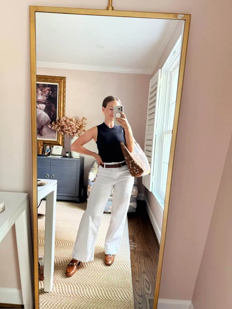 Woman wearing linen pants and structured top with brown belt to work