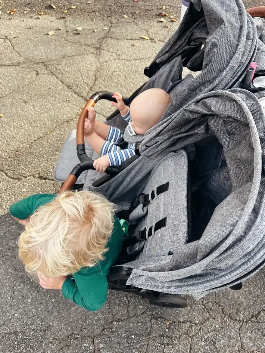 Zoe stroller with baby and toddler riding