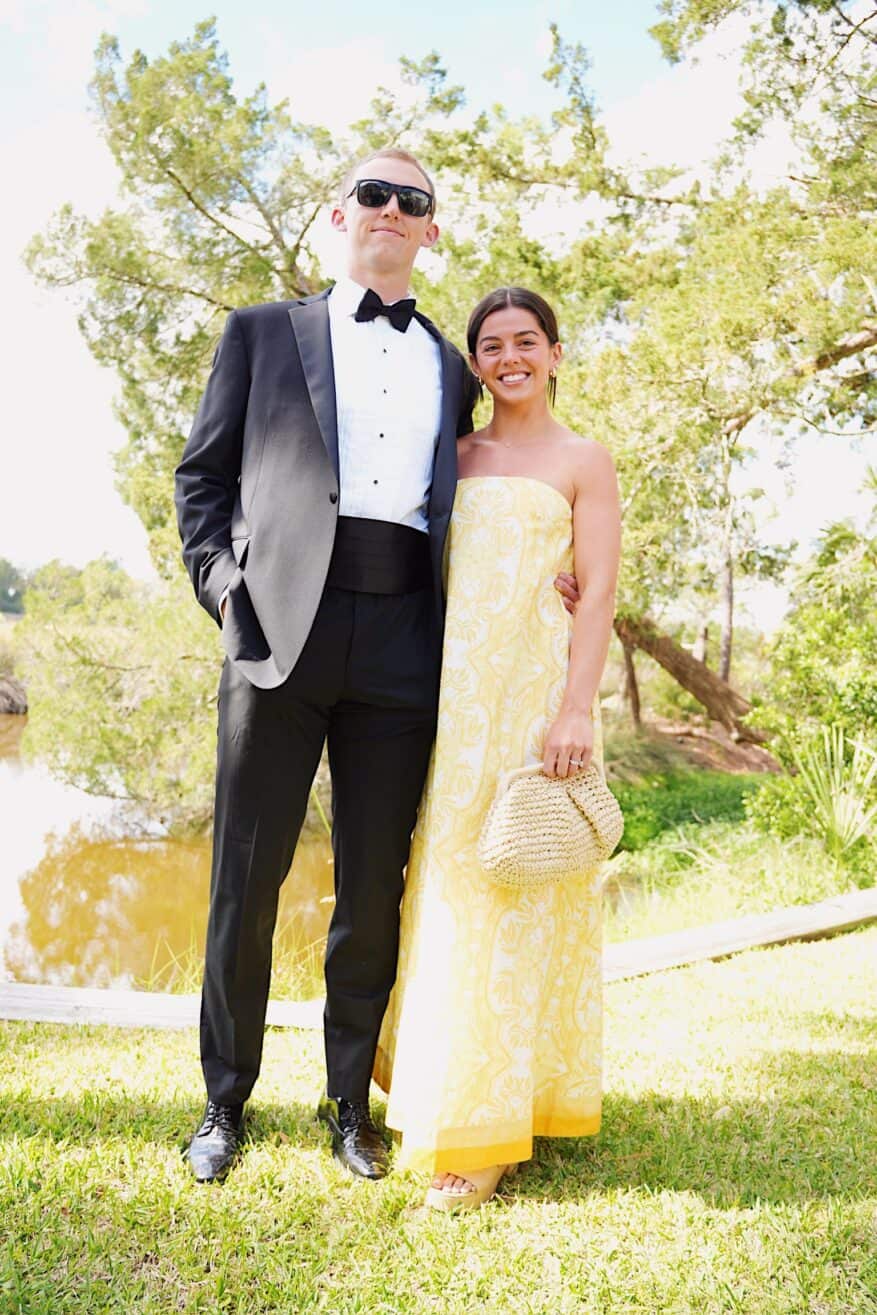 Man in tux and woman in yellow dress