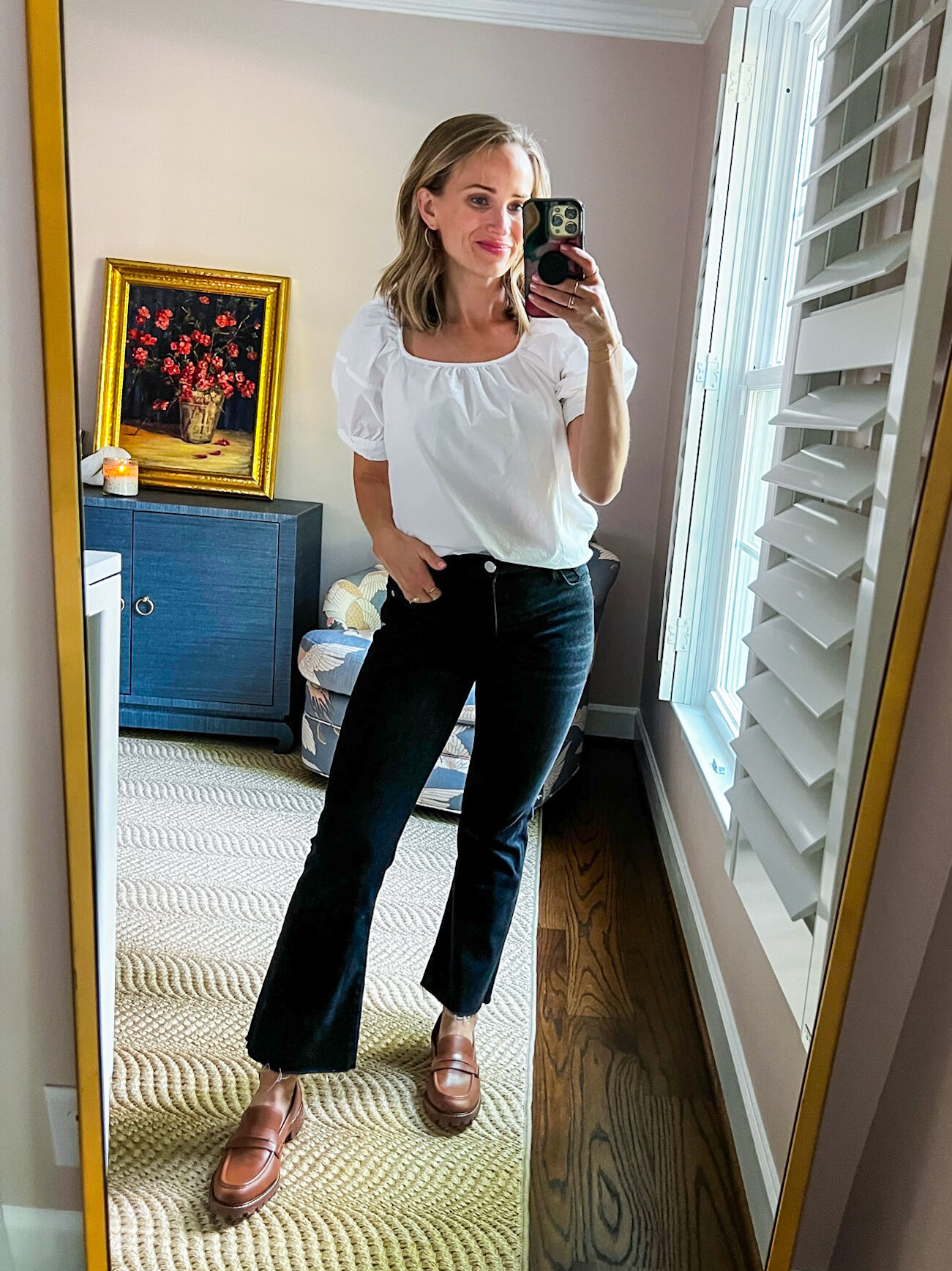 TeriLyn Adams wearing Black Jeans and a White  Blouse as a Cute Teacher Outfits