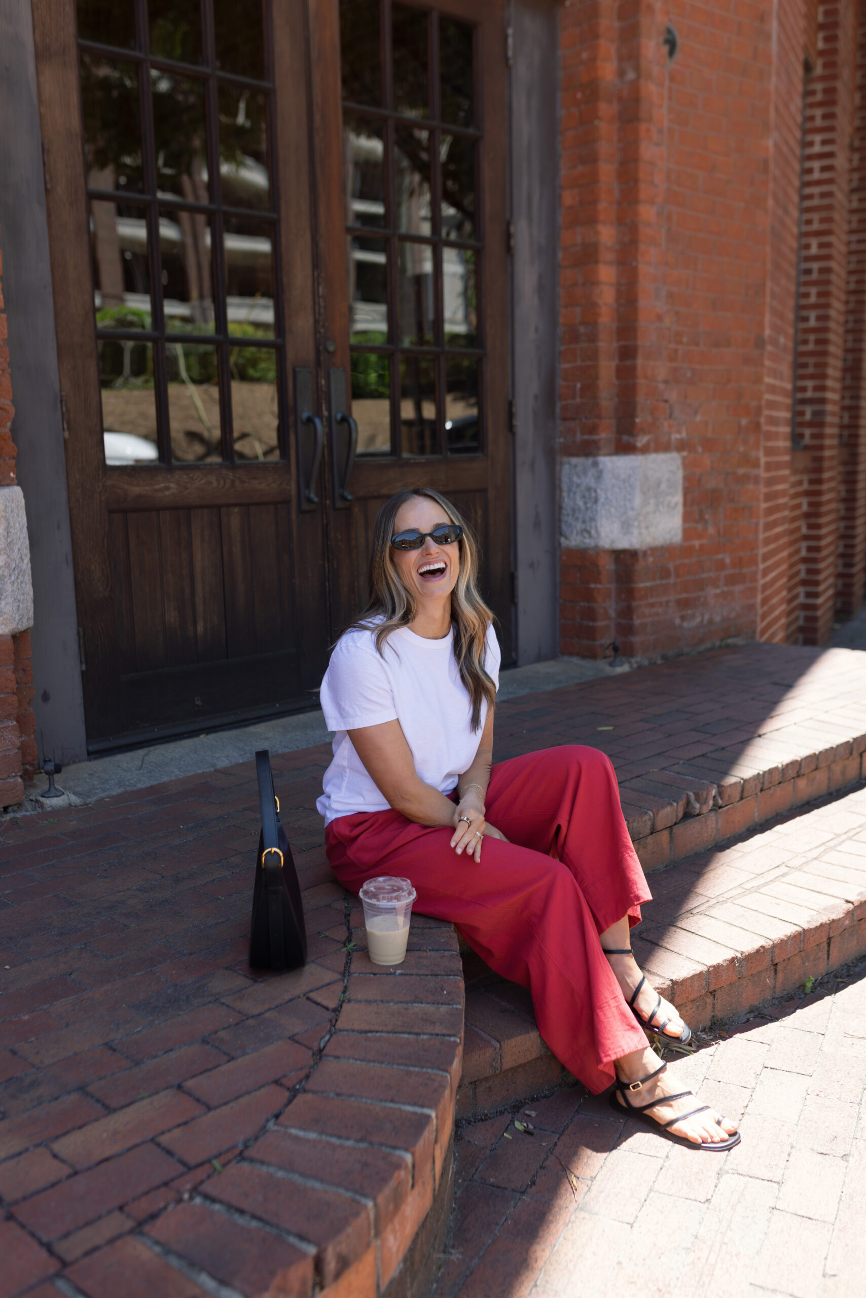 TeriLyn Adams wearing a basic white tee and Gap red linen pants for 4th of July outfits.